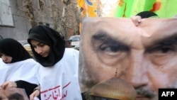 Iranian students invoke the Islamic Republic's late founder, Ayatollah Ruhollah Khomeini, at an anti-Israel rally in Tehran on January 4.