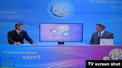 Commentators from Turkmenistan Sport discuss the Euro 2012 football championship live during a broadcast on June 11.