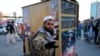 A Taliban fighter reacts to a photographer at a market in Kabul on October 15.
