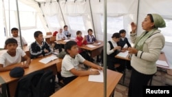 As a new schoolyear begins in Kyrgyzstan, thousands of students will be attending classes in tents or ramshackle buildings. (file photo)