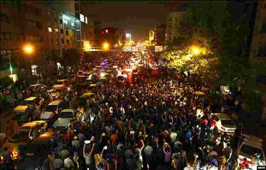 Thousands of Iranians poured onto the streets of the capital and other cities after the early evening announcement on June 15 that Rohani had won the vote and obviated the need for a second round.