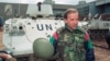 Then-U.S. Senator Joe Biden speaks to reporters in front of a Danish UN armored personnel carrier at the airport in Sarajevo on April 9, 1993.
