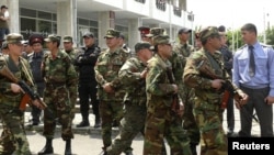 Kyrgyz security forces in Osh try to stabilize the situation in the southern city on May 14.