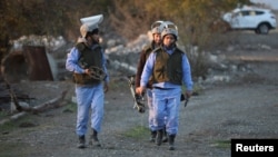 Azerbaijan servicemen near the town of Agdam while clearing land mines (file photo)