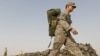 A U.S. soldier carried his bag as he prepared to leave Iraq in mid-August.