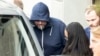 Defendant Yury Harauski enters a court building in Switzerland on the first day of hearings on September 19.