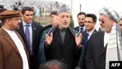 Hamid Karzai (center) with Mohammad Qasim Fahim (left) and Karim Khalili in Kabul on May 4