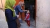 A health worker administers a polio vaccine to a child during a previous campaign in Kabul.