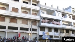 Antiregime protesters gather for a demonstration in the Syrian port city of Banias on May 4.