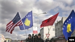 Kosovar Albanians celebrate the first anniversary of Kosovo's independence in Pristina.