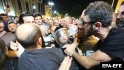 Protesters clashed with riot police during a mass rally in front of parliament in Tbilisi on the night of June 20-21. Hundreds were injured, including dozens of police.