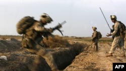 U.S. Marines battle Taliban militants northeast of Marjah in February.