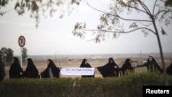 Iranian students form a human chain in November around a uranium conversion facility at Isfahan to show support for that country's nuclear program, which its leaders insist is not aimed at weapon-making.