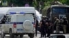 Russian police and National Guardsmen gather near a pretrial detention center in Rostov-on-Don on June 16 during the hostage standoff.