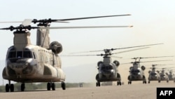 Iranian army helicopters take part in a military drill near the Strait of Hormuz in May, 2010