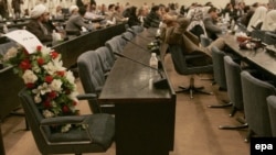 Flowers in Iraq's parliament on the seat of a deputy killed in a bomb attack during a special session in Baghdad in April 2007