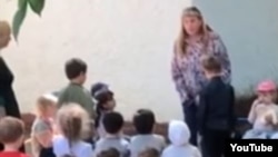 In the video, the kindergarten principal can be seen forcing a boy to kneel in front of her. 