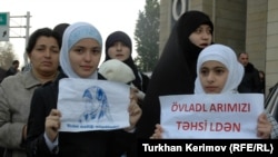 Protesters assemble in front of the Education Ministry to protest against the prohibition against head scarves.