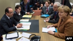 French President Francois Hollande and German Chancellor Angela Merkel discussed the seven-year EU budget in Brussels, Belgium.