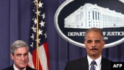 Attorney General Eric Holder (right) and FBI Director Robert Mueller at a news conference in Washington on October 11 announcing details of the alleged assassination plot targeting the Saudi ambassador.