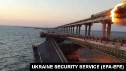 Ukraine has not claimed responsibility for the explosion, which sent one span of the bridge's highway section tumbling into the Kerch Strait and damaged the rail section.