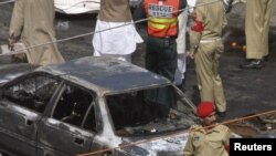 Military personnel secure the site of a suicide bomb attack in Lahore.