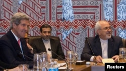 U.S. Secretary of State John Kerry (left) and Iran's Foreign Minister Mohammad Javad Zarif (far right) during a meeting at UN headquarters in September. 