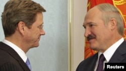 Belarusian President Alyaksandr Lukashenka (right) welcomes German Foreign Minister Guido Westerwelle to Minsk last month, one of his new EU "best friends."