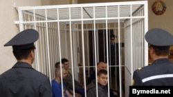 Dzmitry Vus and Mikalay Statkevich in the dock along with fellow defendants Alyaksandar Klaskouski, Alyaksandar Kvyatkevich, Artsyom Hrybkou, Dzmitry Bulanau, and Andrey Pazniyak in Minsk on May 11