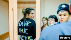 Greenpeace activist Anne Mie Roer Jensen (left) of Denmark looks on during a hearing at the Primorskiy Court in St. Petersburg on November 20.