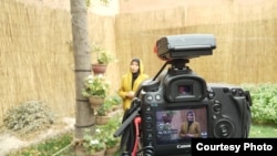 Zuhra Nawrozi being photographed in Kabul