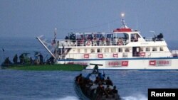 Israeli forces approach one of the six ships bound for Gaza in the Mediterranean Sea on May 31.