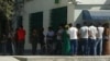 People waiting to take out money from ATM machines in Ashgabat in August 2019.