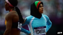 Afghanistan's Tahmina Kohistani (right) despite failing to qualify, ran a personal best time of 14.42 on August 3.