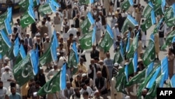 Activists of the Jamaat-e Islami Pakistani group shout slogans against the reopening of the route for NATO supplies to Afghanistan during a protest in Lahore on March 23.