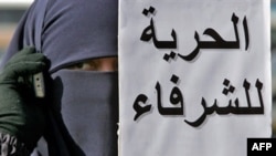 An Egyptian woman protests in support of the Muslim Brotherhood, considered moderate among Islamist groups