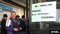 Moldovan migrant workers in the Czech Republic wait for a bus home.