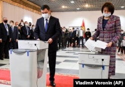 Kyrgyz President Sadyr Japarov and his wife, Aigul Asanbaeva, cast their ballots at a polling station in Bishkek.