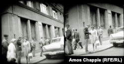 The same scene as shot by the leather-jacketed agent. Another man holding a briefcase, possibly the second photographer, lingers near Kundera.