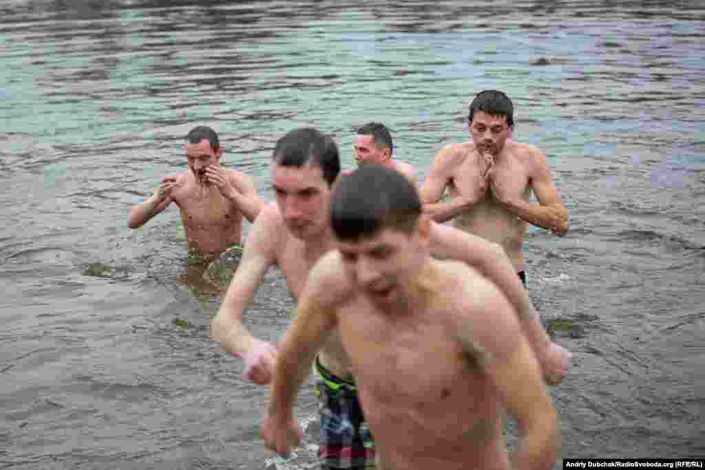 It could have been much colder for these believers. In past years, participants have had to cut through the ice of the frozen Dnieper River for their Epiphany swim. This winter, however, has been relatively mild.