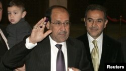 Iraqi's Prime Minister Nuri al-Maliki casting his vote for the Iraqi parliamentary elections.