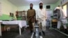 Afghans who were maimed in land mine blasts practice walk with prosthetic limbs at a Red Cross center in Herat. (file photo)