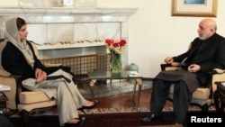 Afghan President Hamid Karzai meets with Pakistani Foreign Minister Hina Rabbani Khar in Kabul on February 1.