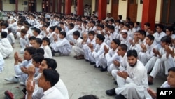 Students pray for the early recovery of Malala Yousafzai at a government school in Mingora, the main town of the northwestern Swat Valley.