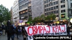 People protest against the rule of Serbian Prime Minister Aleksandar Vucic in Belgrade on April 19