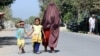 An Afghan family leaves Kunduz following clashes between Taliban and Afghan security forces.