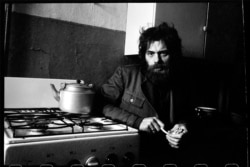 Poet Viktor Krivulin sitting in a Leningrad kitchen in 1978.