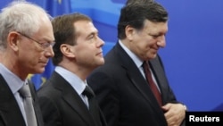 Russian President Dmitry Medvedev (center) is welcomed by European Council President Herman Van Rompuy (left) and European Commission President Jose Manuel Barroso in Brussels.