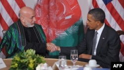 U.S. President Barack Obama (right) and his Afghan counterpart, Hamid Karzai, must also review and officially confirm the document.