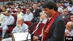 Iran's handling of postelection dissent since the disputed 2009 election has included mass trials, like this one in Tehran in August 2009.